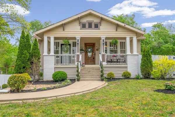 front view of a house with a yard