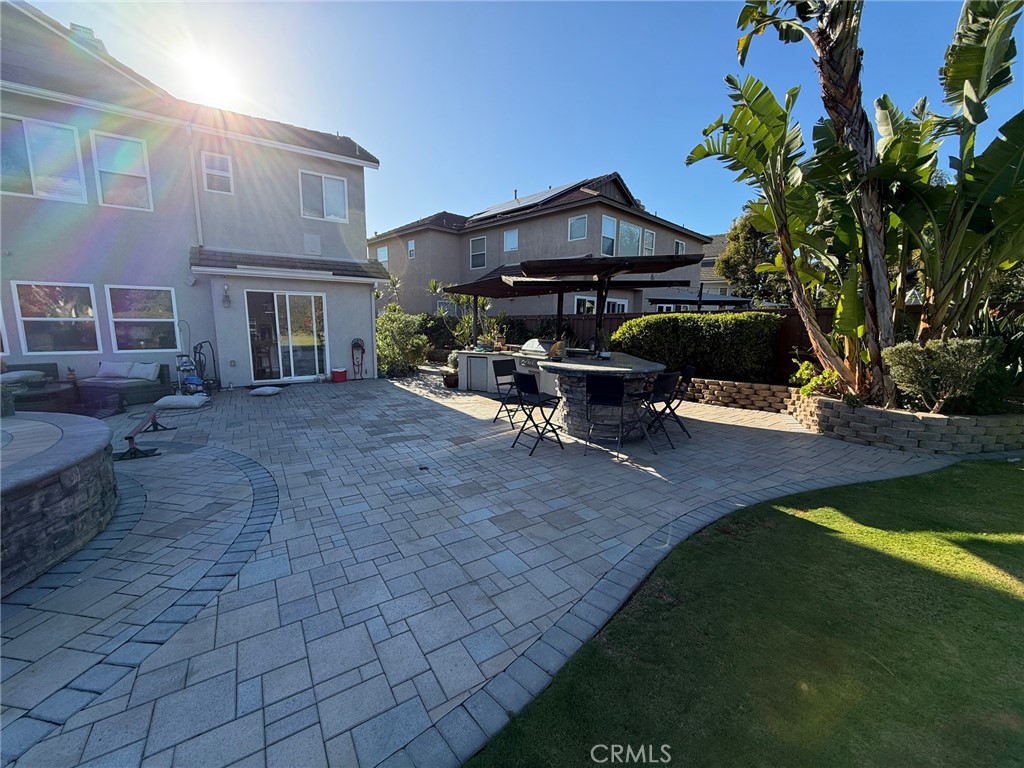3918 Rill Court Carlsbad, CA 92010 - Photo 16 of 19 a view of a house with backyard and sitting area