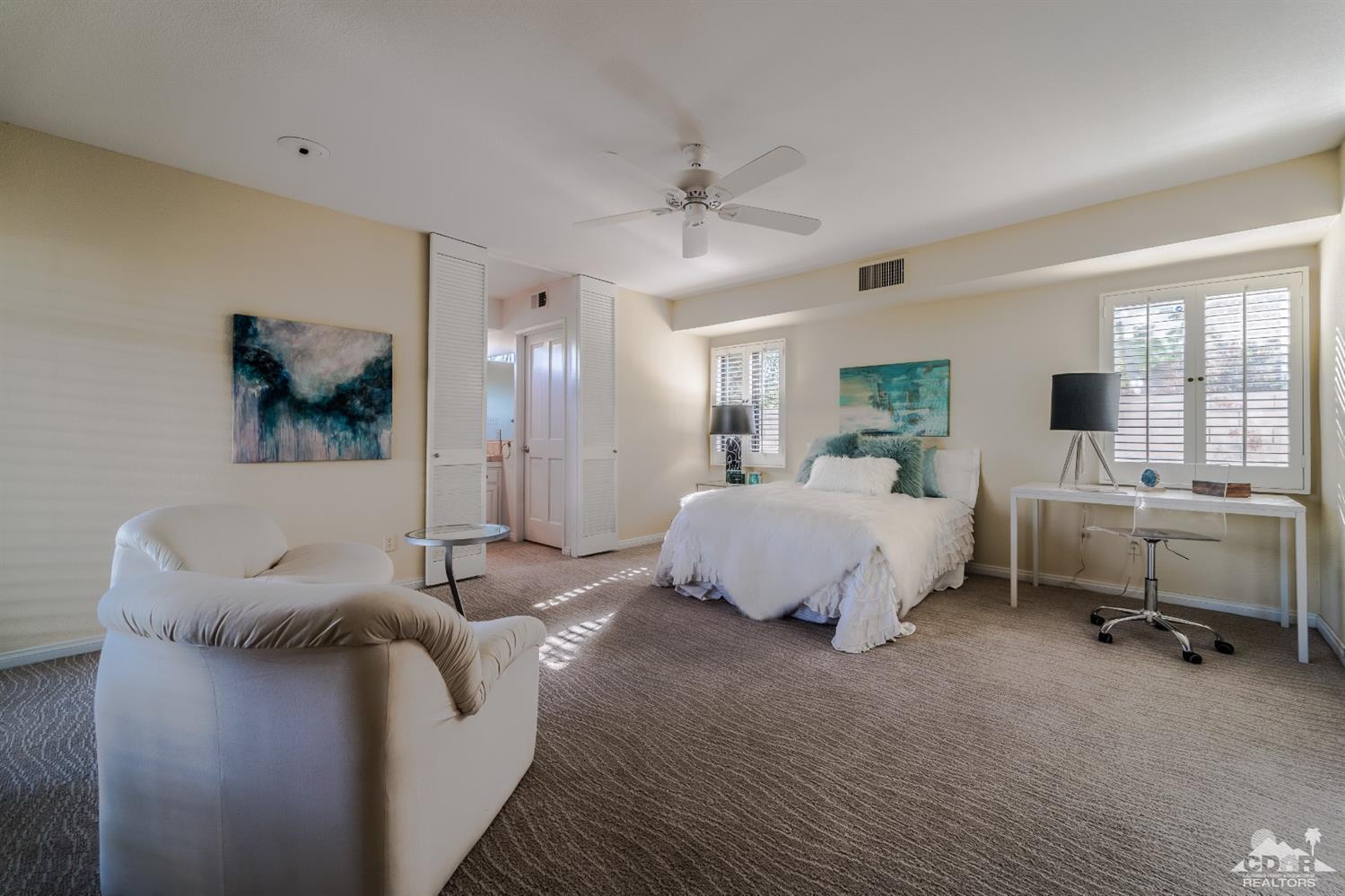 8 Kevin Lee Lane Rancho Mirage, CA 92270 - Photo 11 of 21 a bed room with a bed and a couch