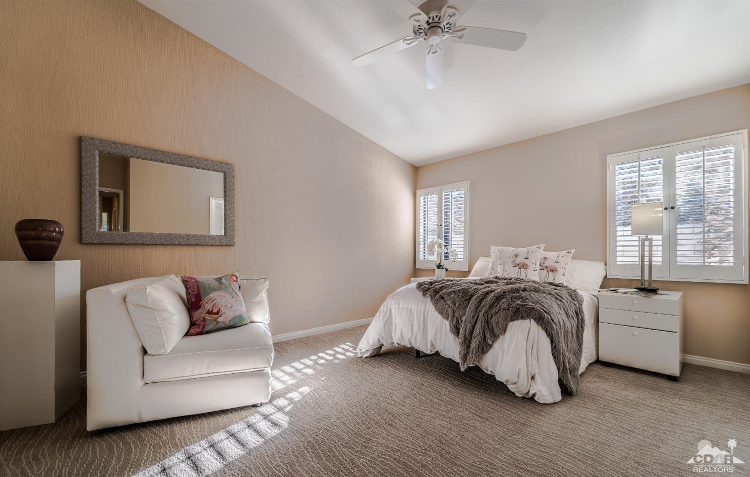 8 Kevin Lee Lane Rancho Mirage, CA 92270 - Photo 14 of 21 a bedroom with a bed and ceiling fan