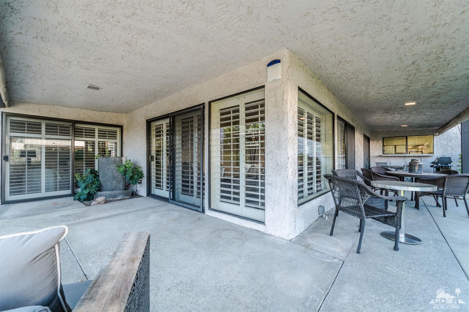 8 Kevin Lee Lane Rancho Mirage, CA 92270 - Photo 19 of 21 a view of a livingroom with furniture and porch