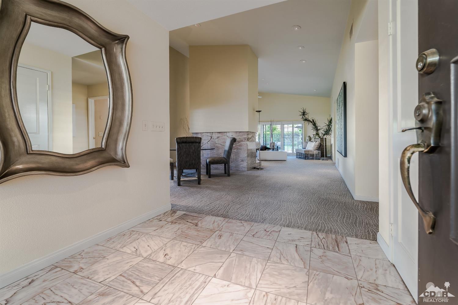 8 Kevin Lee Lane Rancho Mirage, CA 92270 - Photo 4 of 21 a view of a livingroom with furniture and a mirror