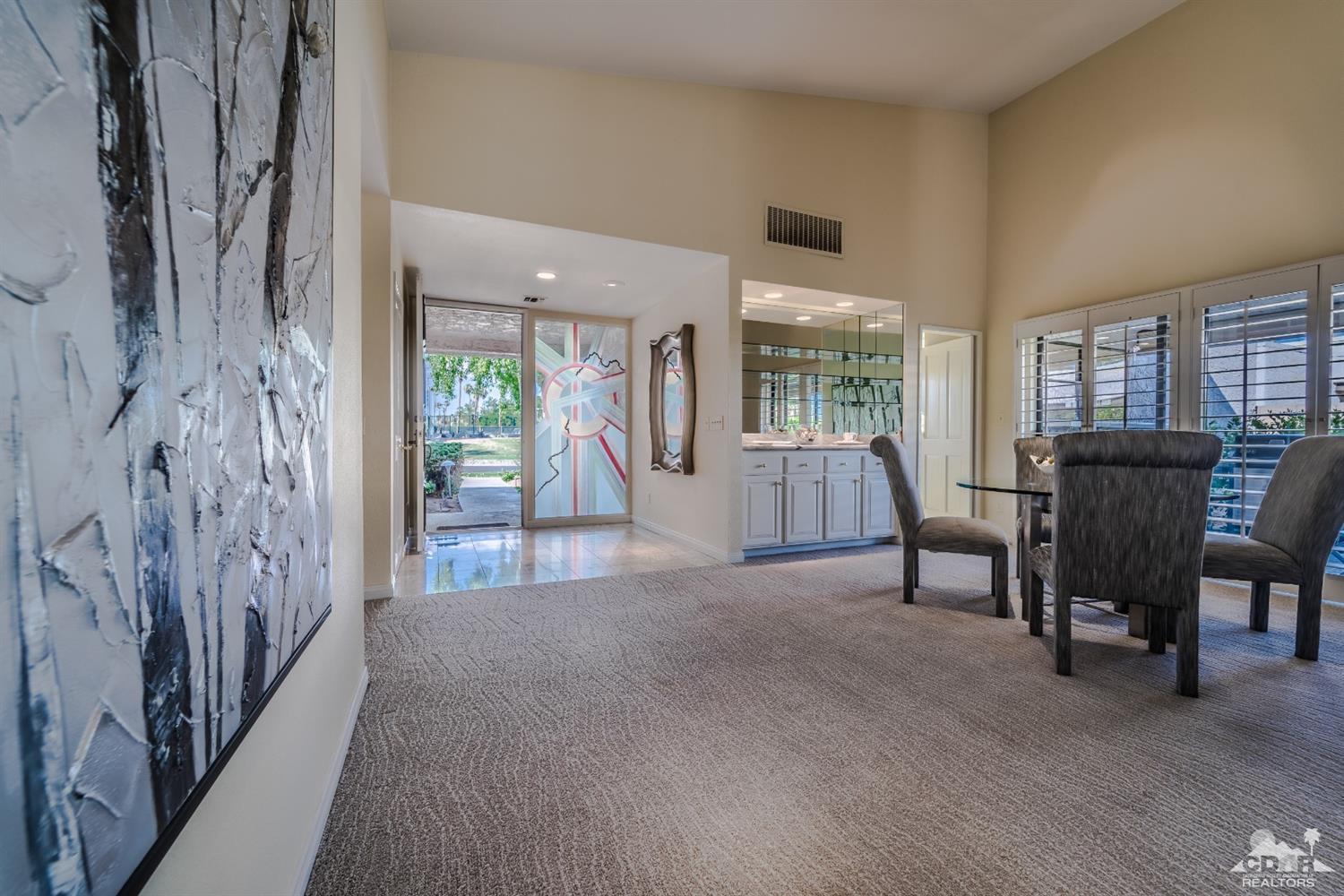 8 Kevin Lee Lane Rancho Mirage, CA 92270 - Photo 5 of 21 a view of a livingroom with furniture and windows