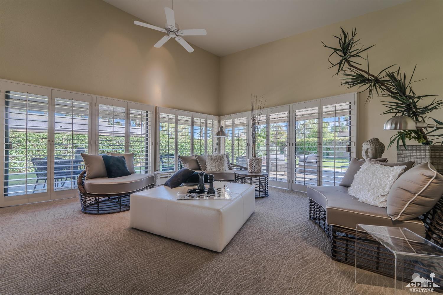 8 Kevin Lee Lane Rancho Mirage, CA 92270 - Photo 7 of 21 a living room with furniture and large windows