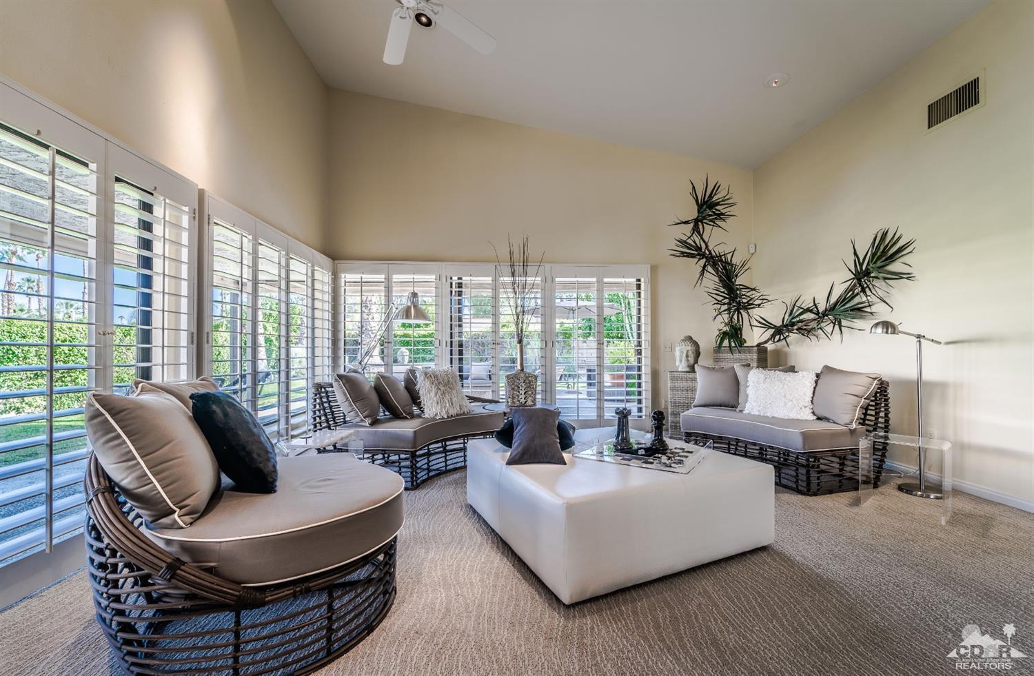 8 Kevin Lee Lane Rancho Mirage, CA 92270 - Photo 8 of 21 a living room with furniture and a large window