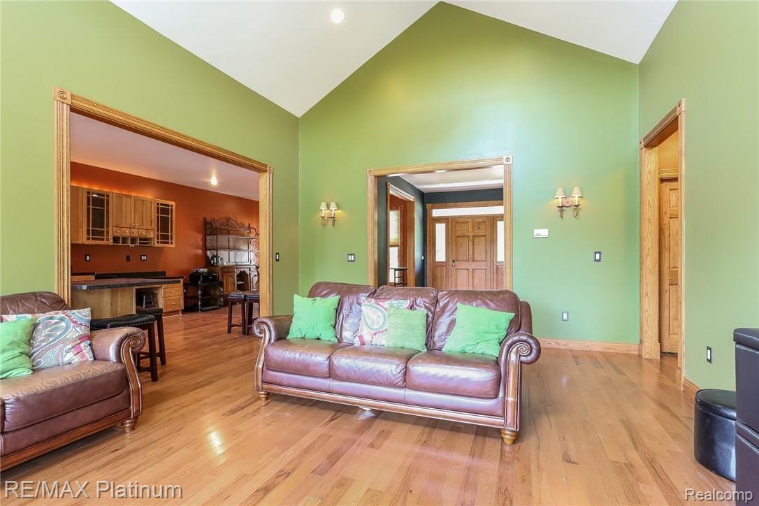 125 Keddle Road Howell, MI 48843 - Photo 6 of 35 Living Room With High Ceilings and Wood Floors