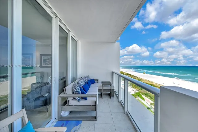 a view of swimming pool with seating area