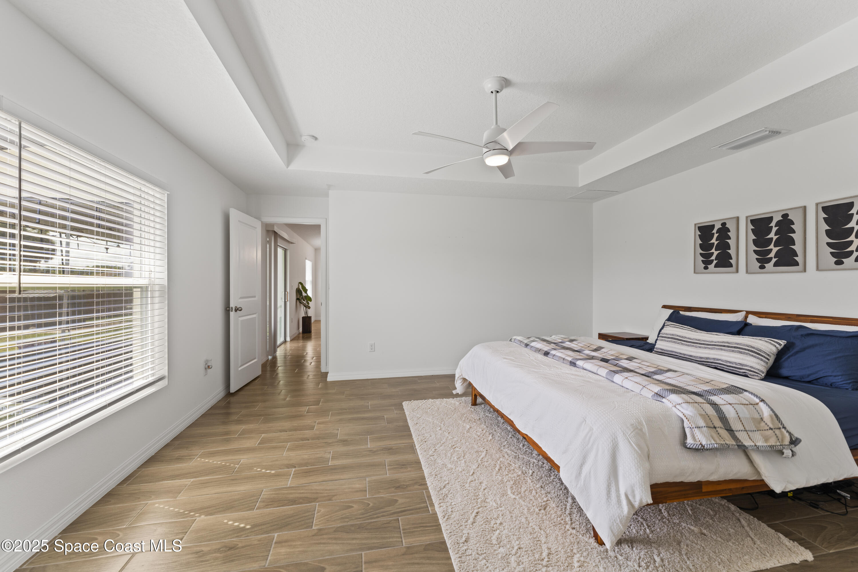 1938 Jupiter Boulevard Southwest Palm Bay, FL 32908 - Photo 12 of 21 a bedroom with bed and window