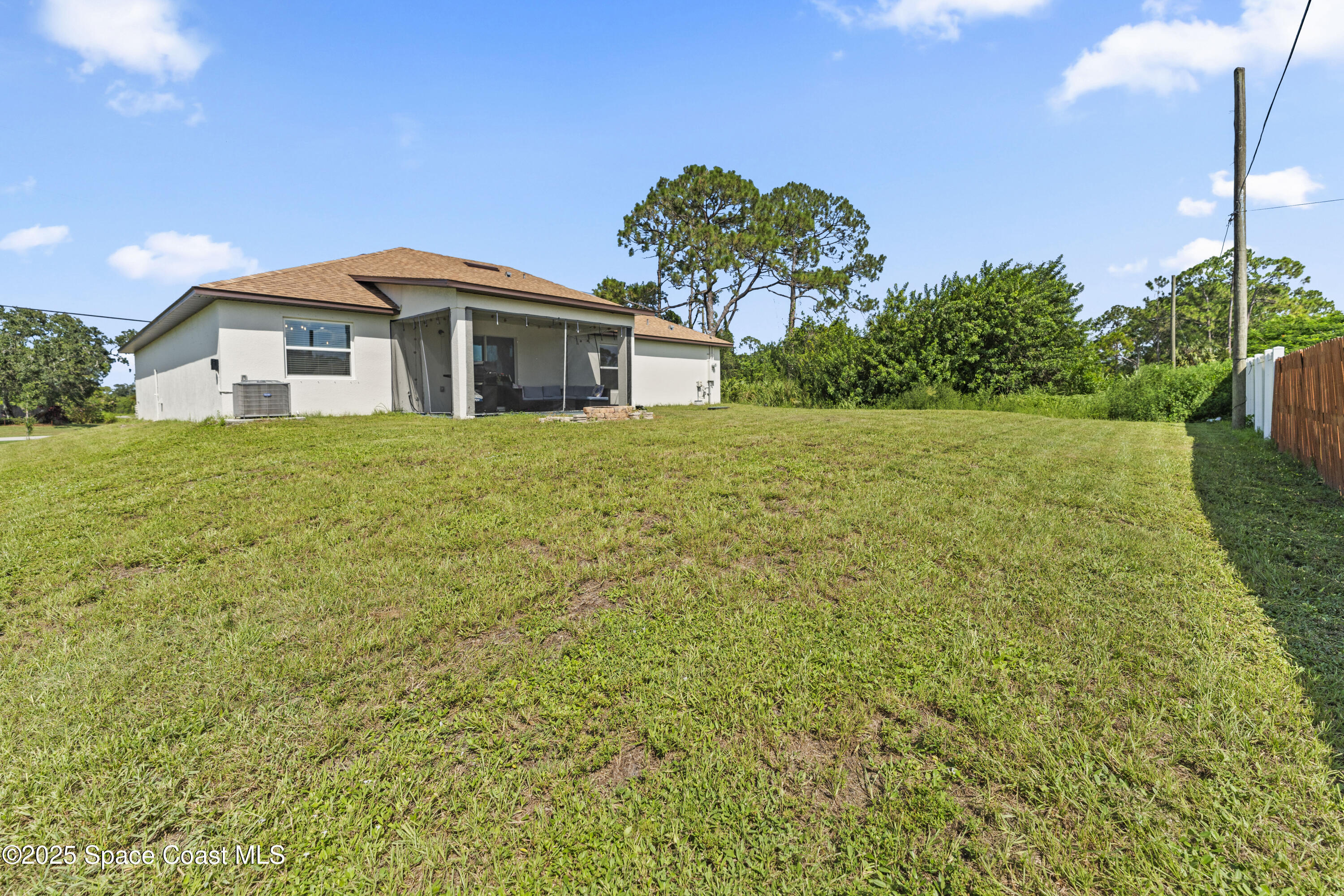 1938 Jupiter Boulevard Southwest Palm Bay, FL 32908 - Photo 21 of 21 a front view of a house with a yard