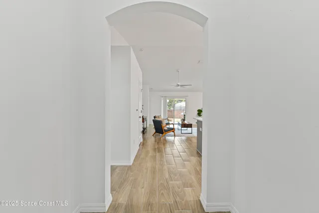 a view of a livingroom with furniture and an entryway