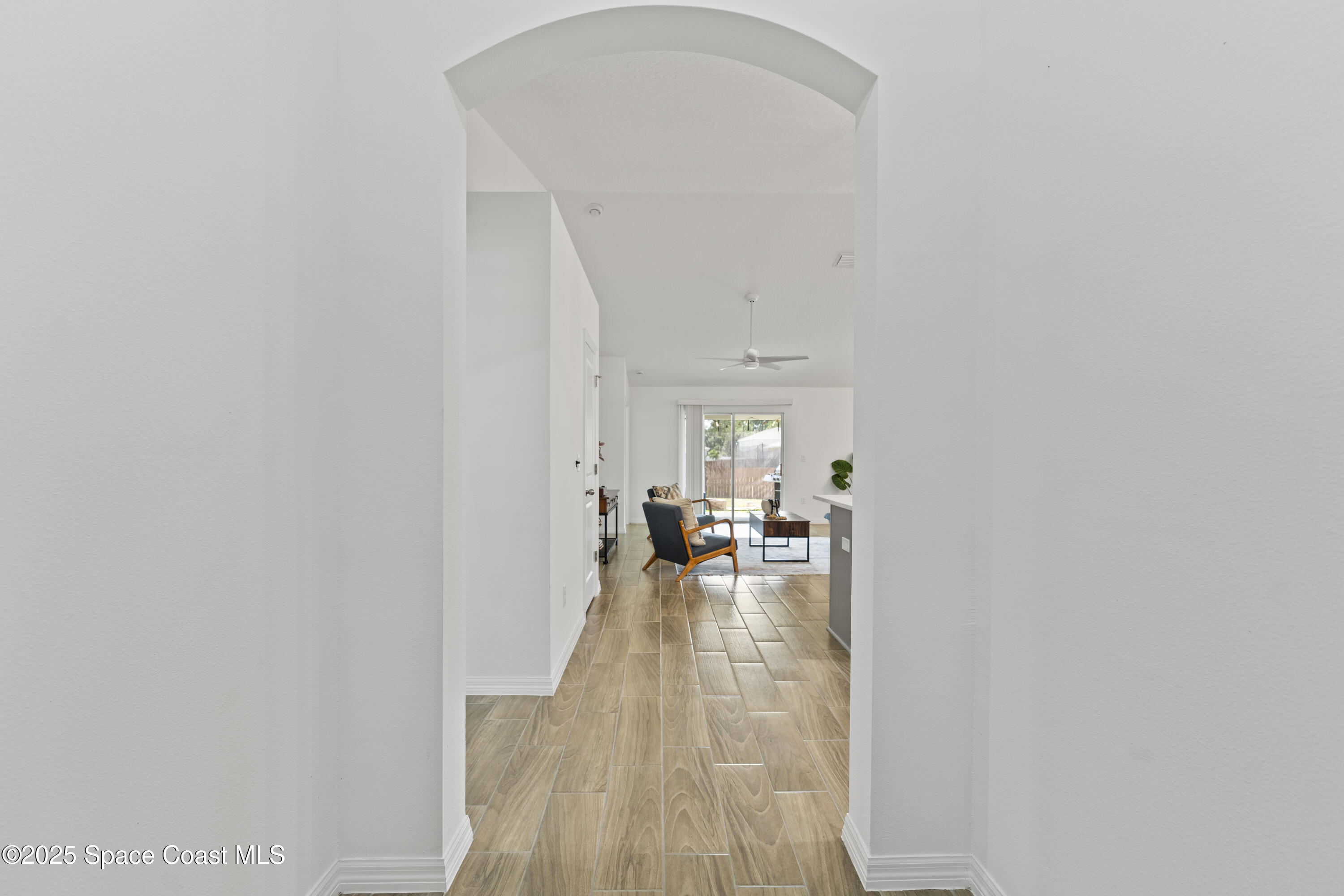 1938 Jupiter Boulevard Southwest Palm Bay, FL 32908 - Photo 3 of 21 a view of a livingroom with furniture and an entryway
