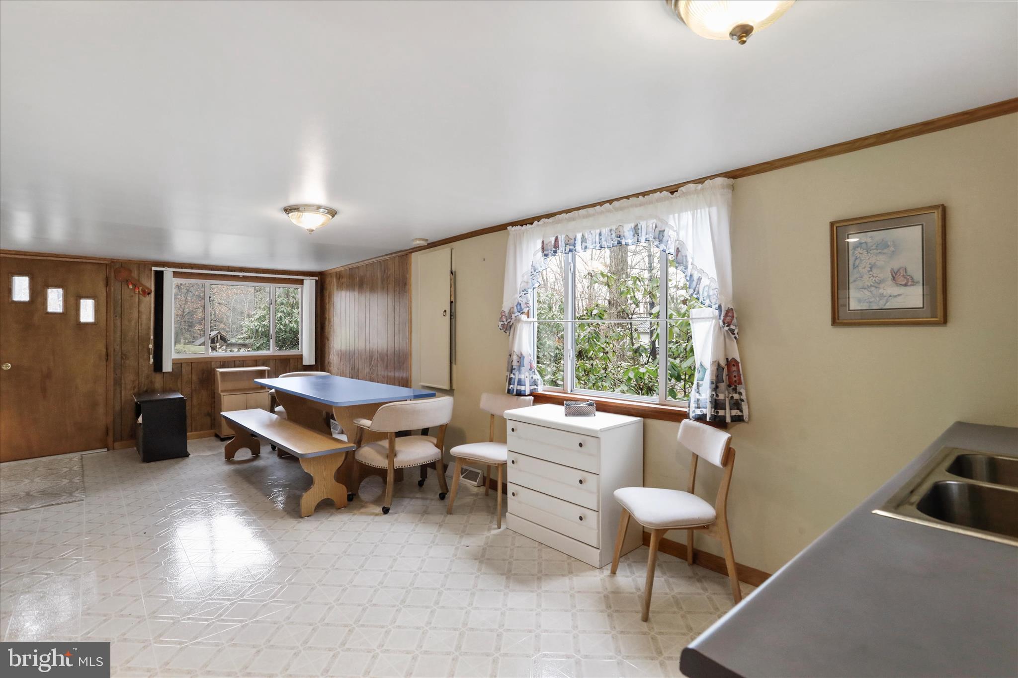 222 Skippers Point Road Oakland, MD 21550 - Photo 12 of 59 a living room with furniture and a large window