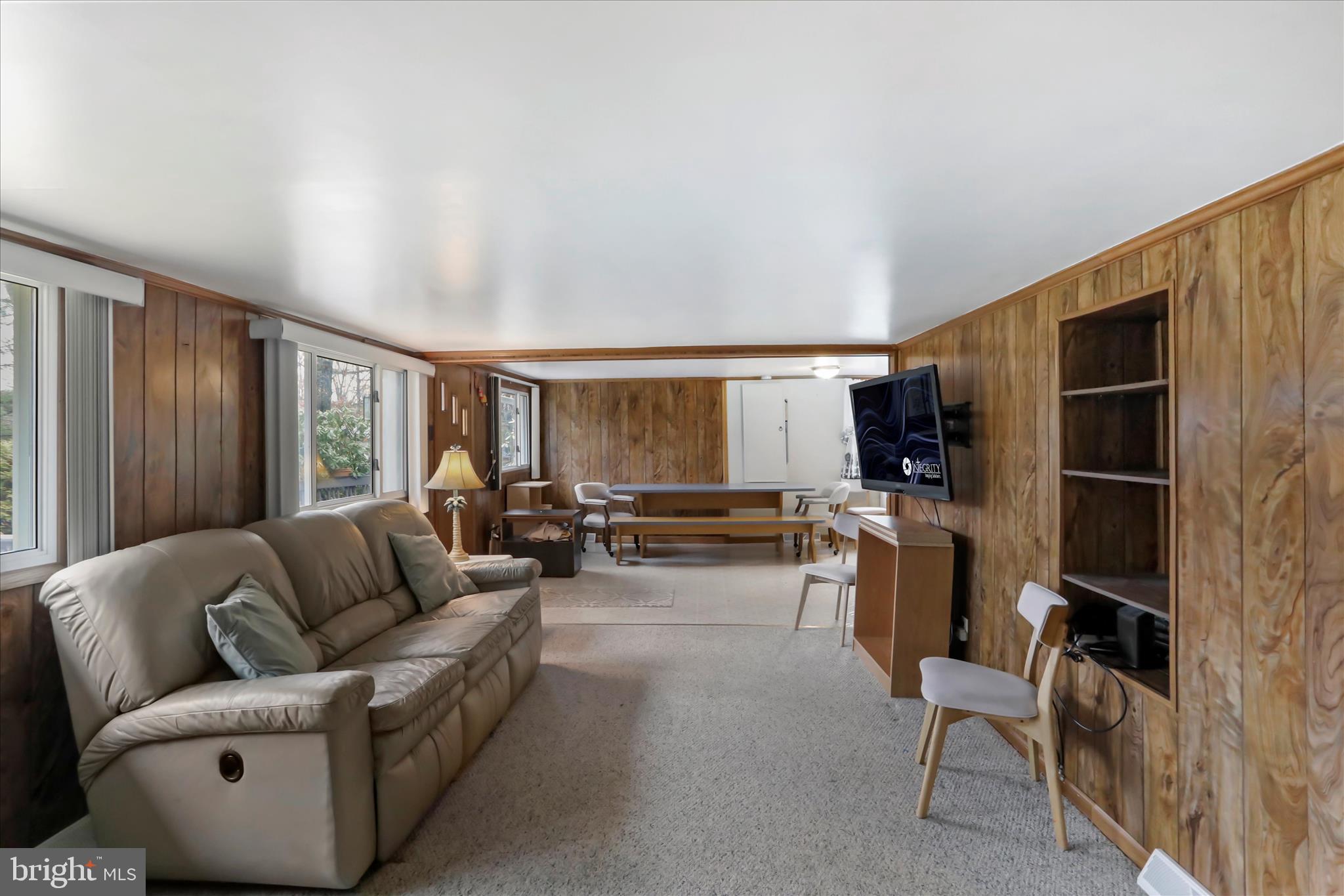 222 Skippers Point Road Oakland, MD 21550 - Photo 14 of 59 a living room with furniture and a flat screen tv