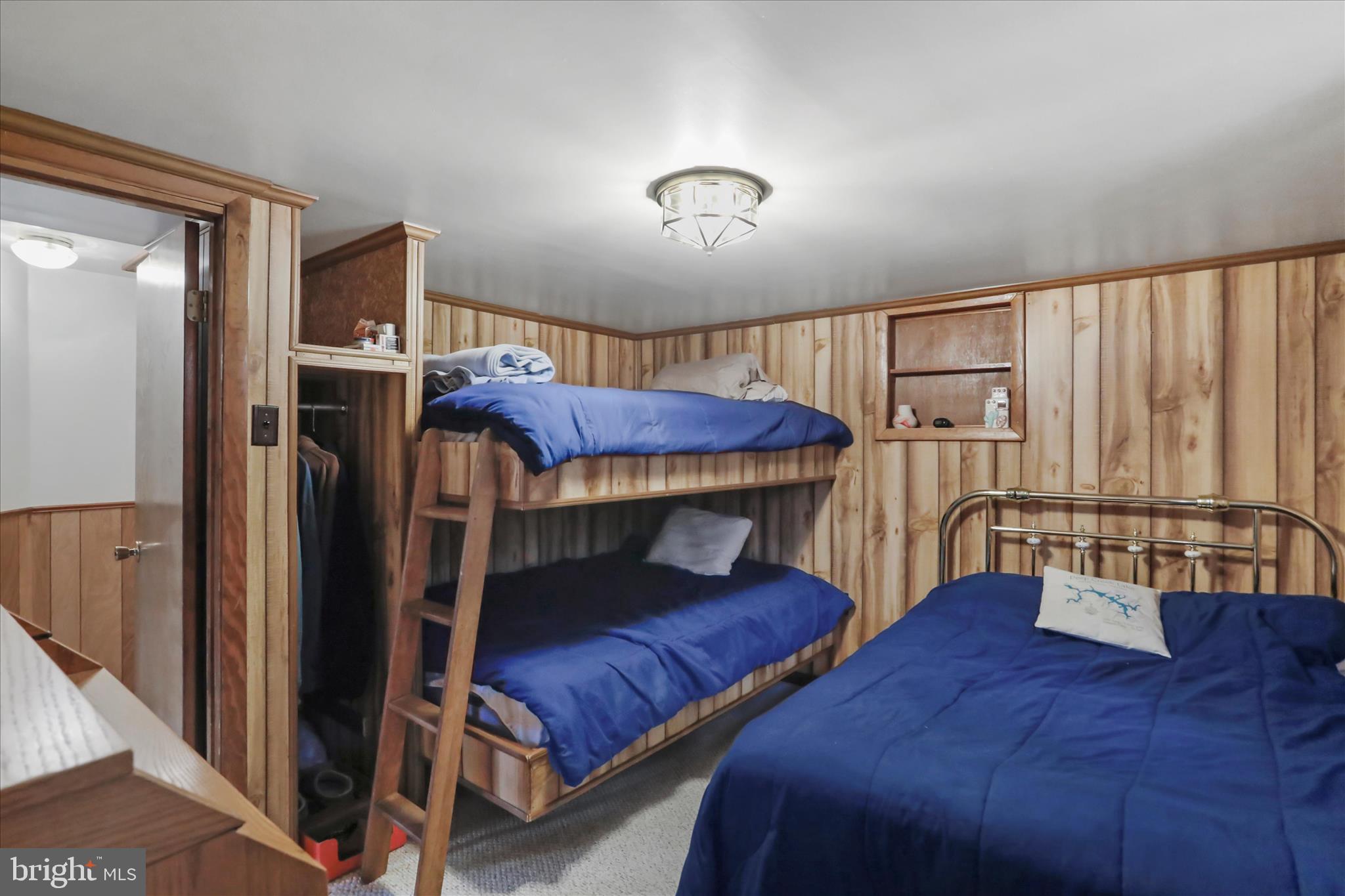 222 Skippers Point Road Oakland, MD 21550 - Photo 15 of 59 a bedroom with furniture and a large window