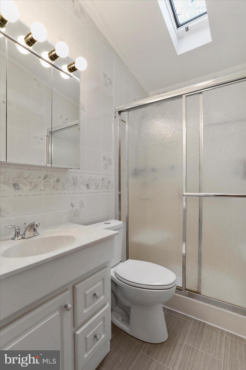 222 Skippers Point Road Oakland, MD 21550 - Photo 17 of 59 a bathroom with a sink a toilet and shower