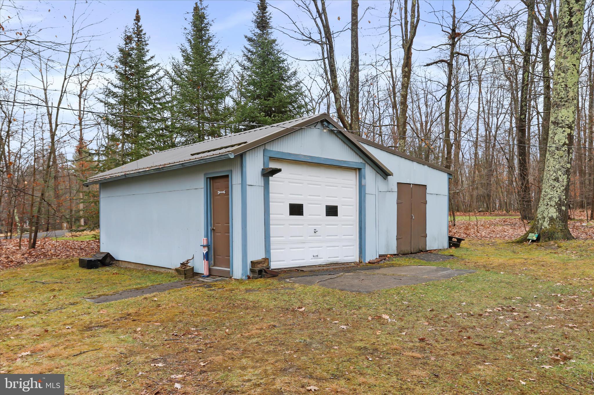 222 Skippers Point Road Oakland, MD 21550 - Photo 28 of 59 a view of a house with backyard and trees