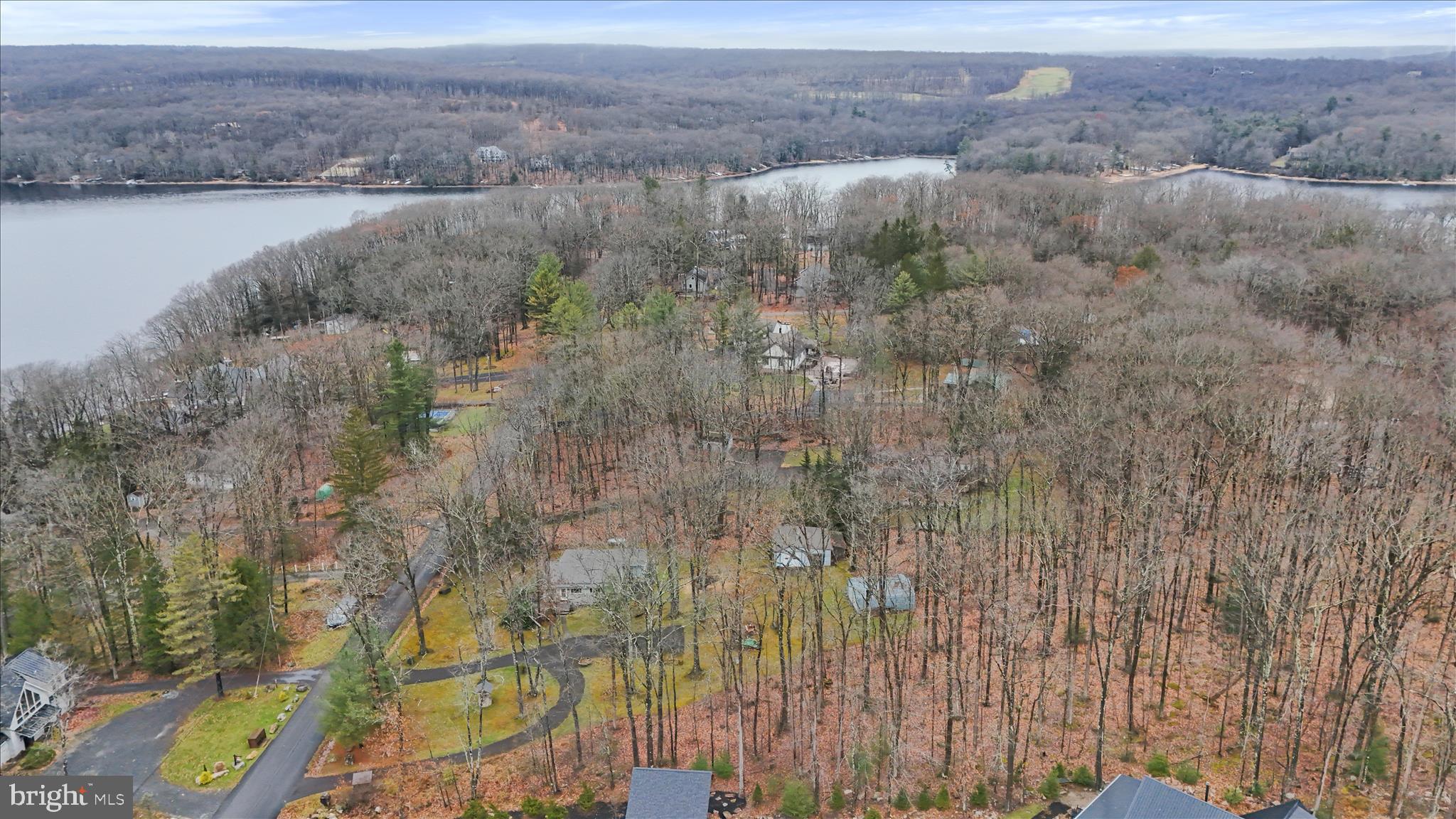 222 Skippers Point Road Oakland, MD 21550 - Photo 51 of 59 a view of a lake with a mountain