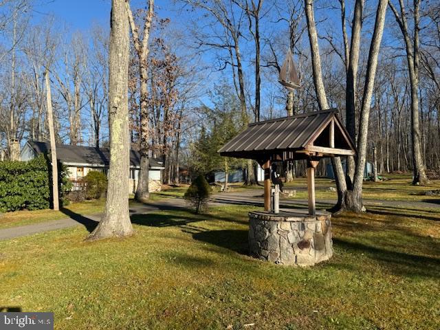 222 Skippers Point Road Oakland, MD 21550 - Photo 53 of 59 a view of a house with backyard and sitting area