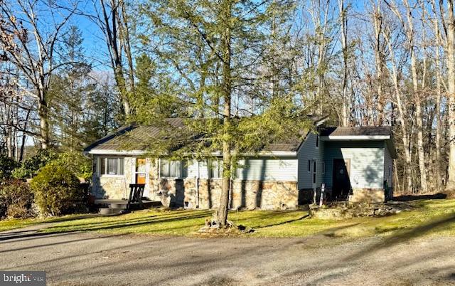 222 Skippers Point Road Oakland, MD 21550 - Photo 6 of 59 a front view of a house with a yard