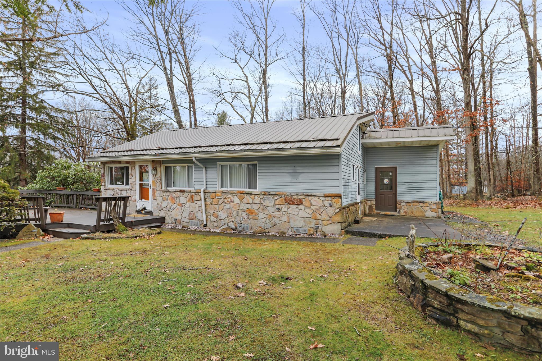 222 Skippers Point Road Oakland, MD 21550 - Photo 8 of 59 a view of a house with swimming pool and sitting area