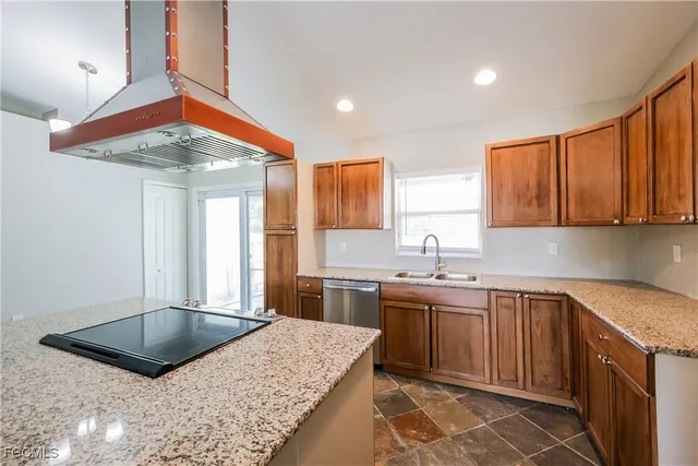 a kitchen with a sink stove and cabinets