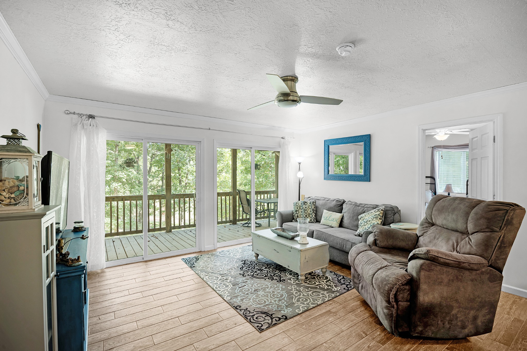 44 G & S Rock Ranch Road Camden, TN 38320 - Photo 12 of 23 a living room with furniture and a floor to ceiling window