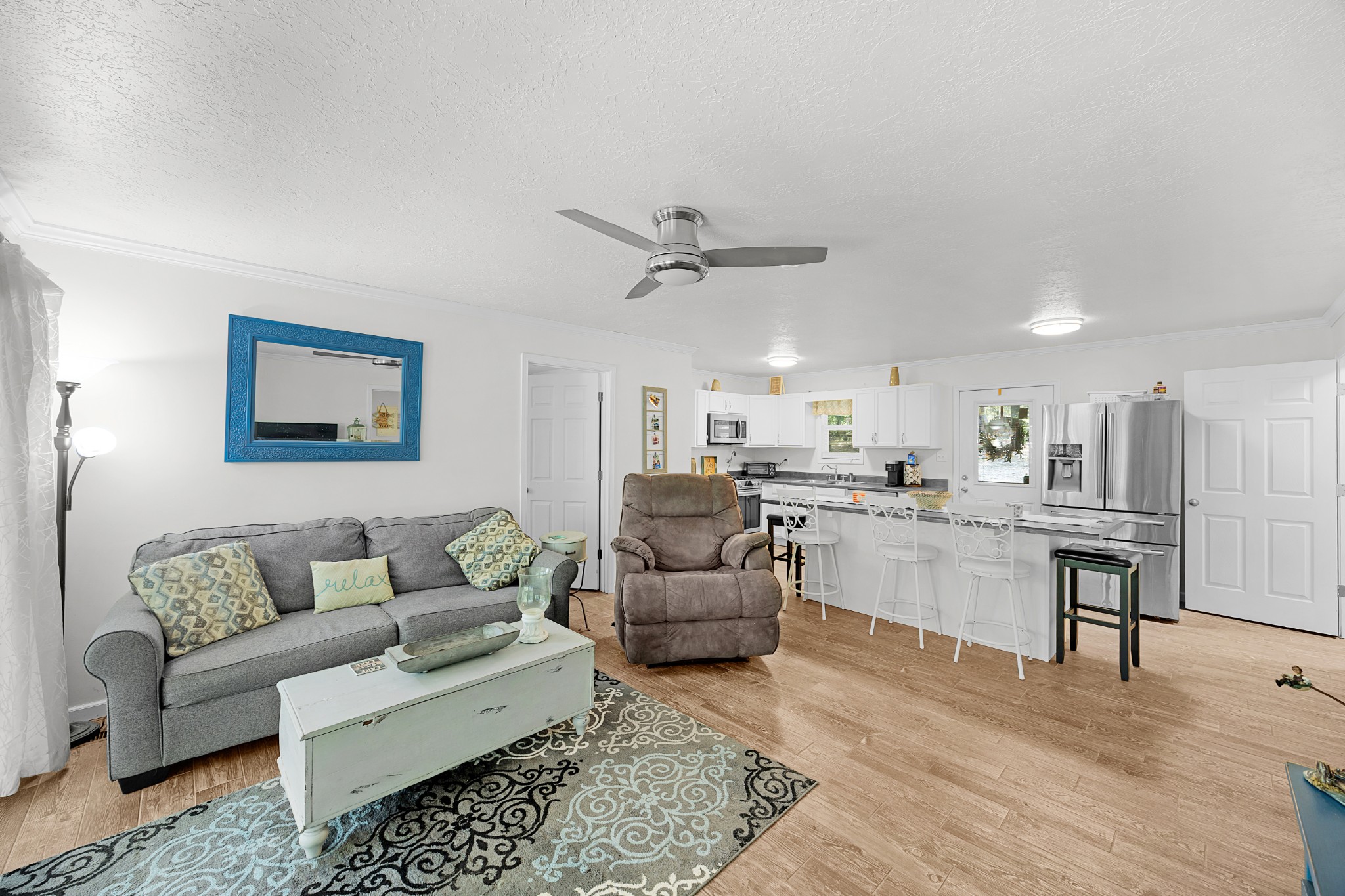 44 G & S Rock Ranch Road Camden, TN 38320 - Photo 13 of 23 a living room with furniture and kitchen view