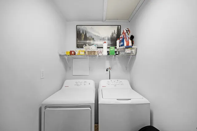 a bathroom with a sink toilet and mirror