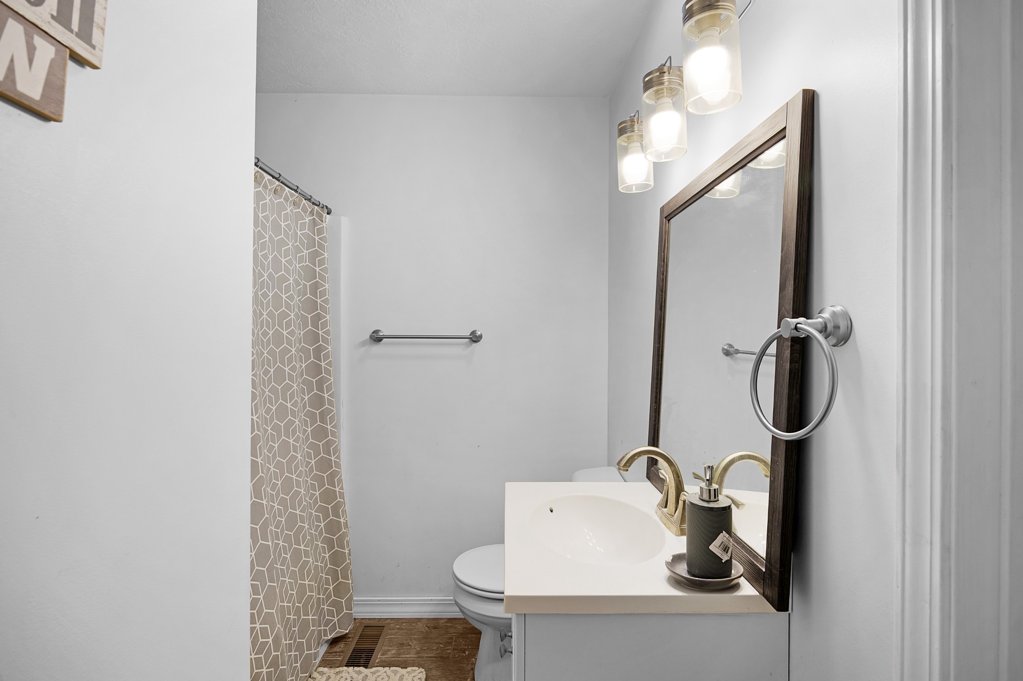 44 G & S Rock Ranch Road Camden, TN 38320 - Photo 18 of 23 a bathroom with a sink toilet and mirror