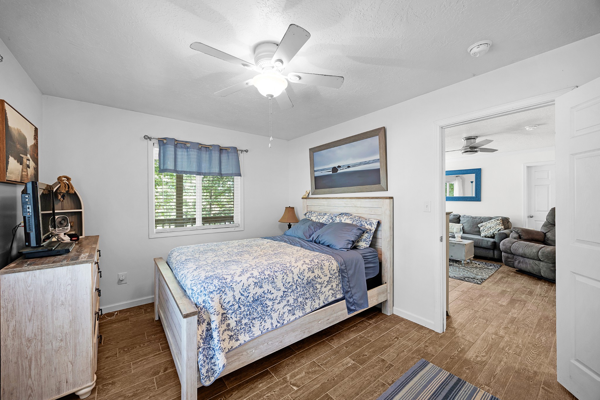 44 G & S Rock Ranch Road Camden, TN 38320 - Photo 21 of 23 a bedroom with a bed and a couch