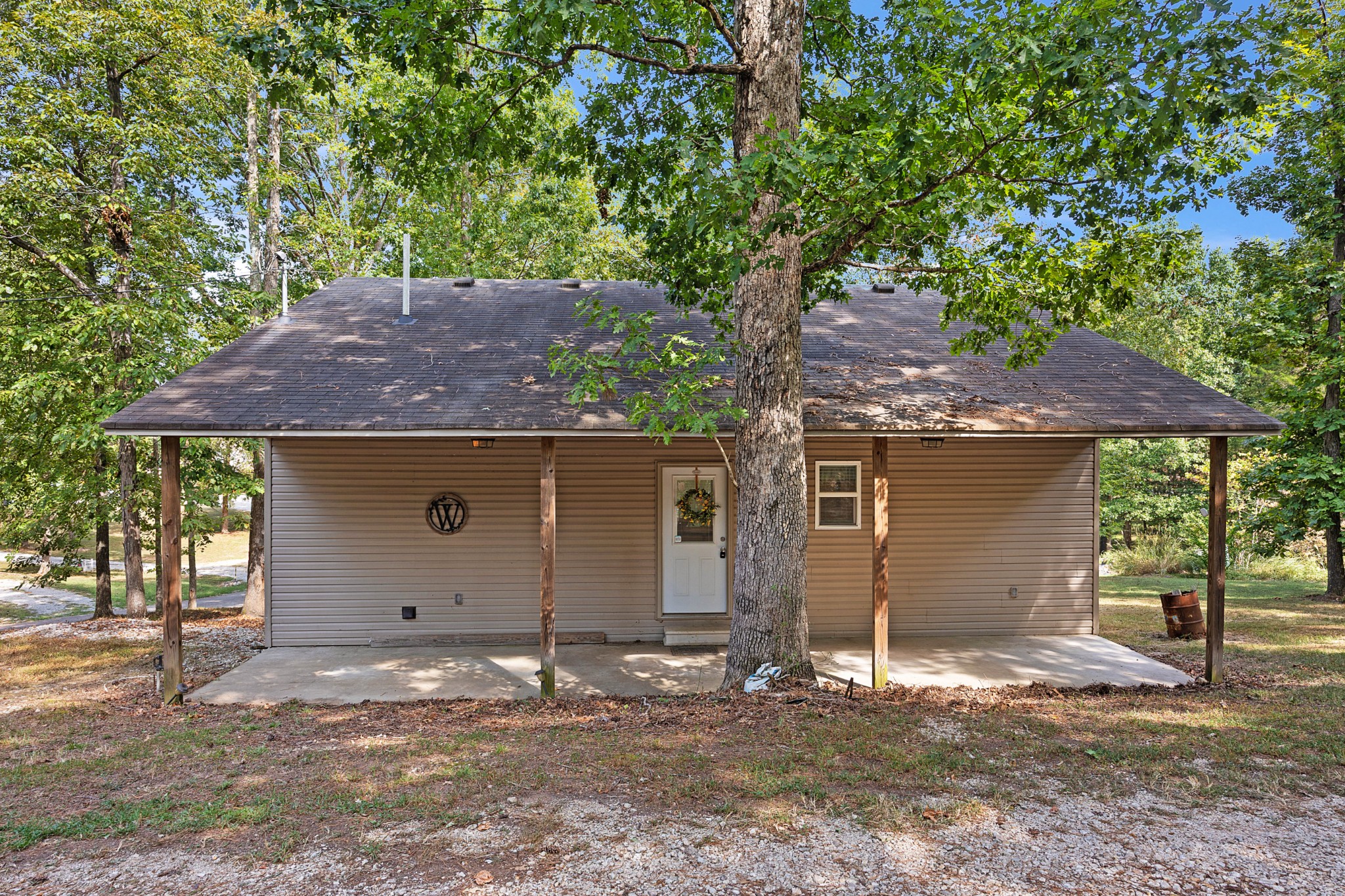 44 G & S Rock Ranch Road Camden, TN 38320 - Photo 5 of 23 a backyard of house with a tree
