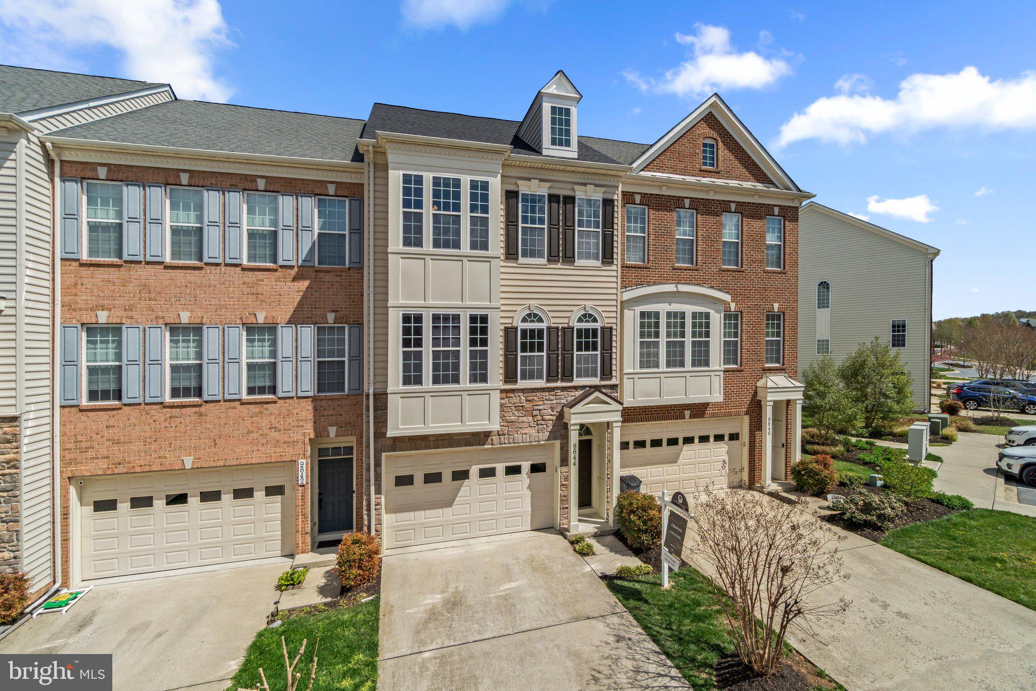 9644 Bothwell Lane Frederick, MD 21704 - Photo 2 of 68 a front view of a building with a garden