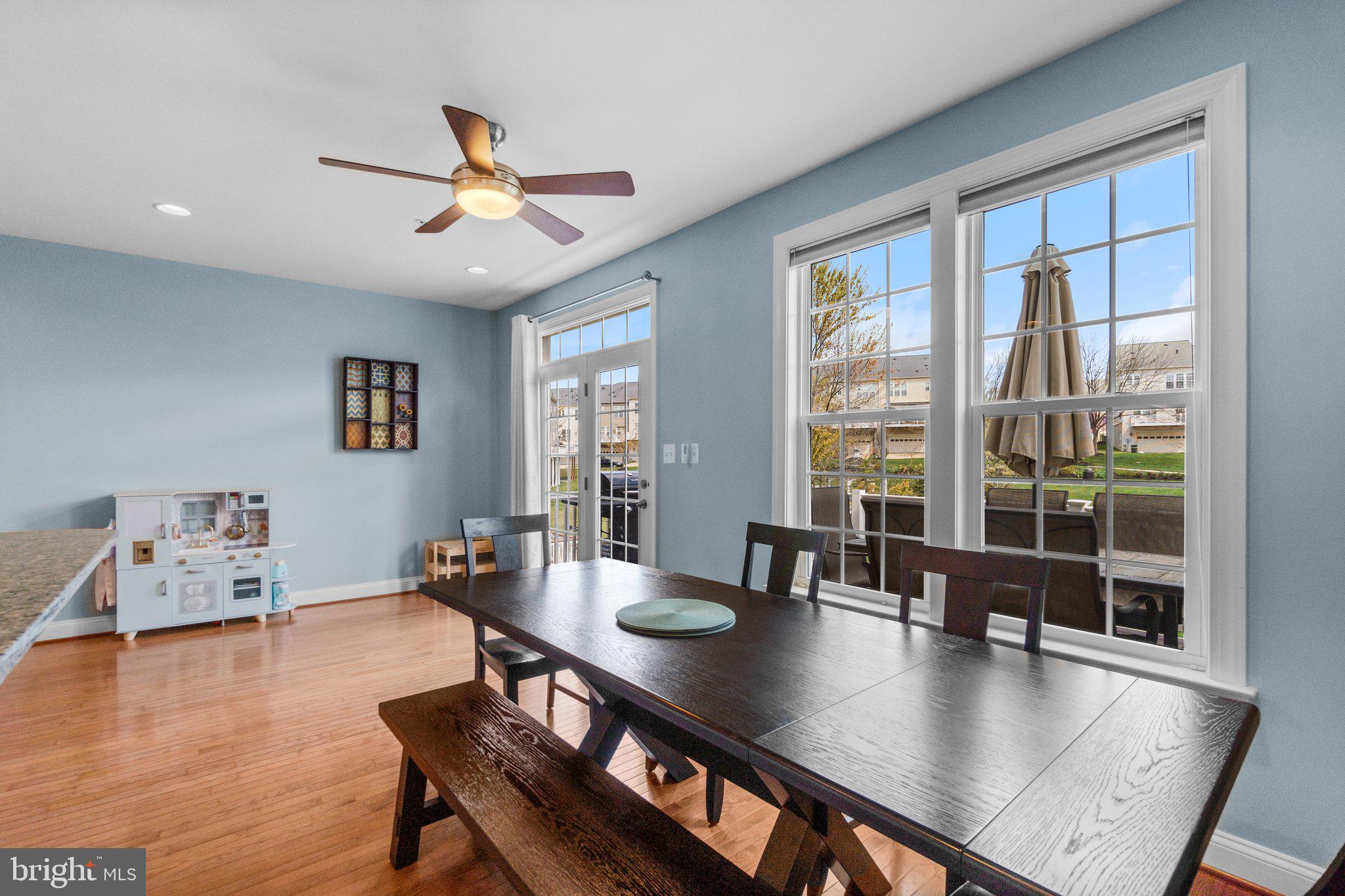9644 Bothwell Lane Frederick, MD 21704 - Photo 21 of 68 a view of a dining room with furniture window and wooden floor