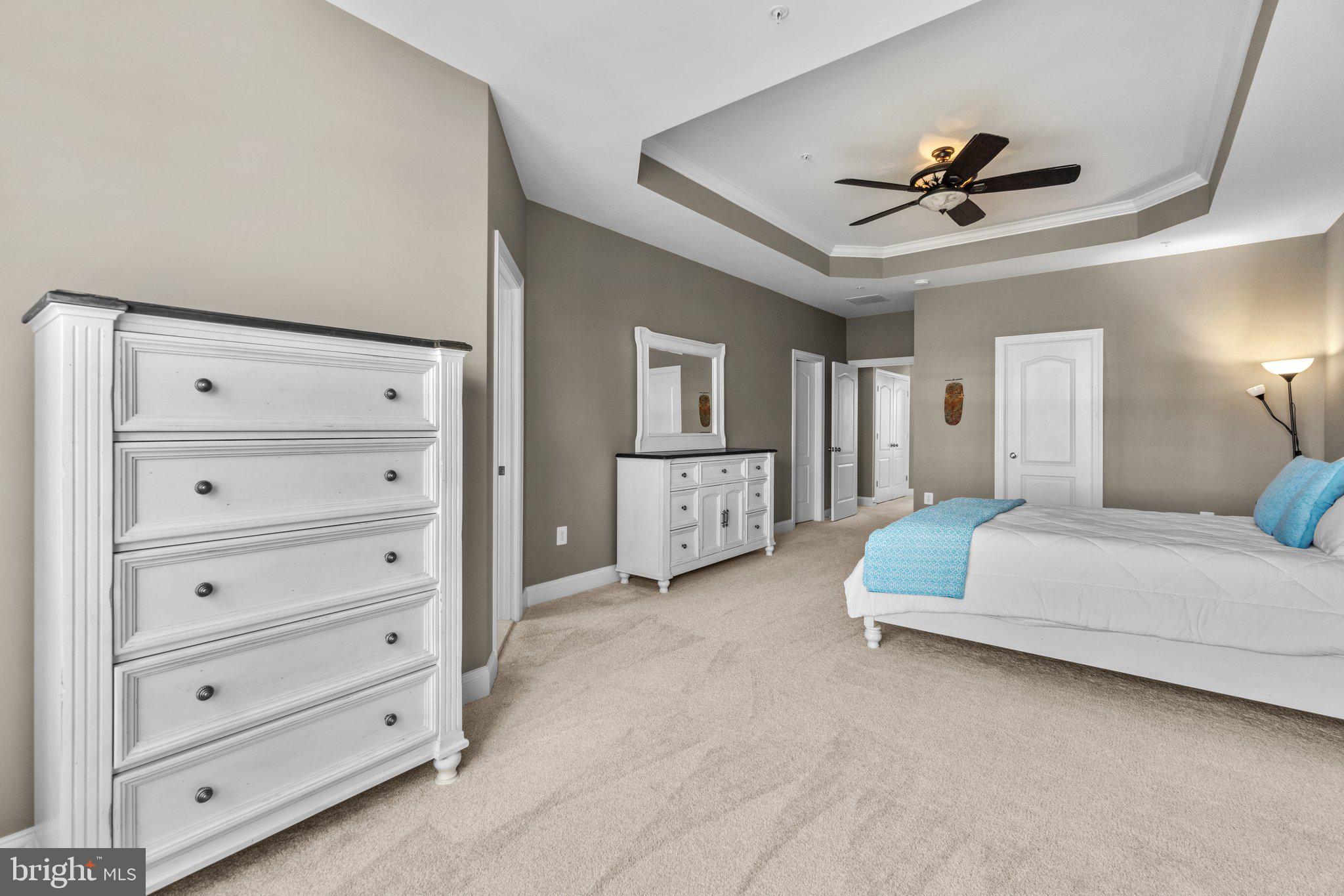 9644 Bothwell Lane Frederick, MD 21704 - Photo 27 of 68 a spacious bedroom with a bed and a ceiling fan