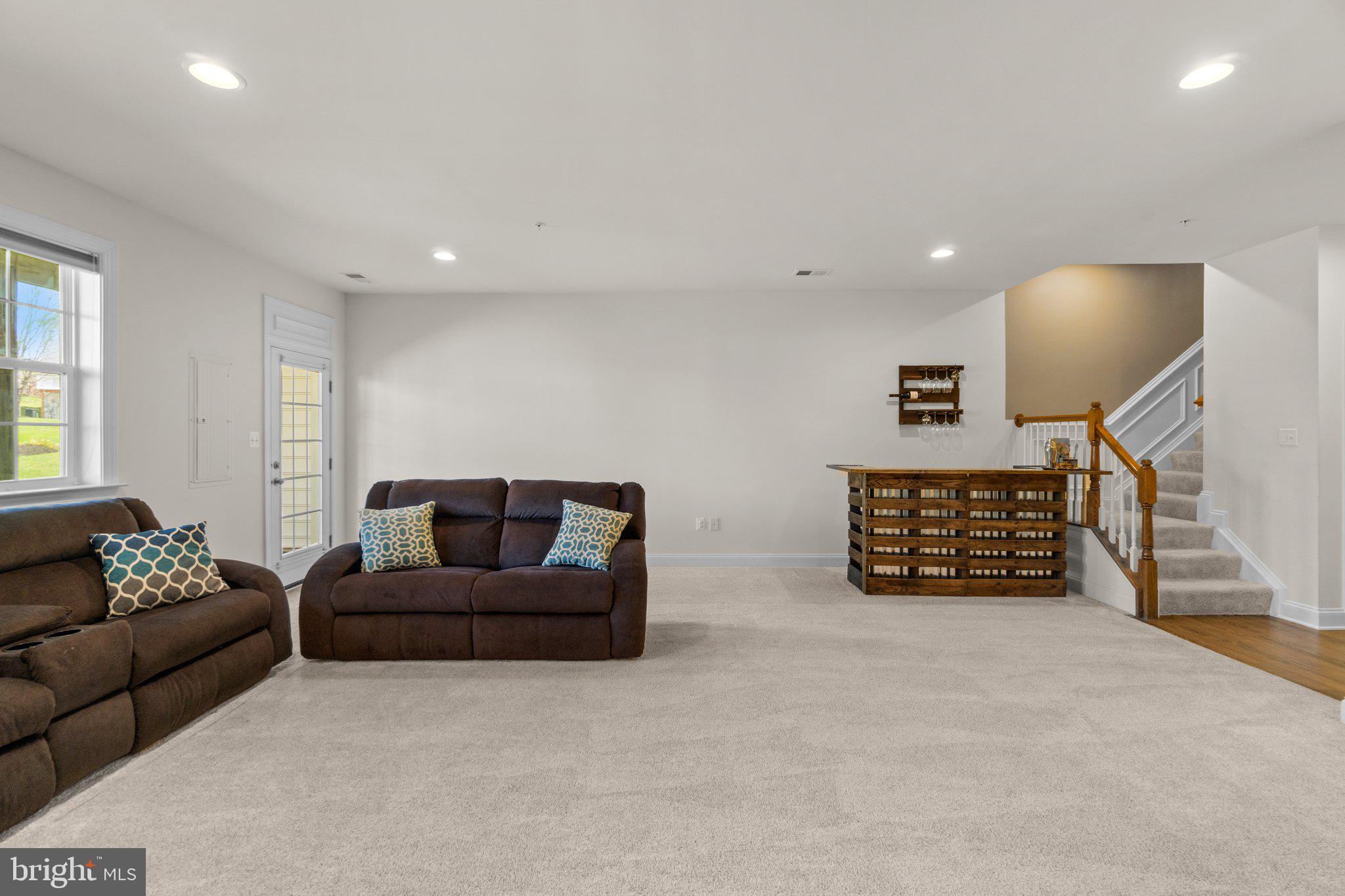 9644 Bothwell Lane Frederick, MD 21704 - Photo 42 of 68 a living room with furniture and a couch