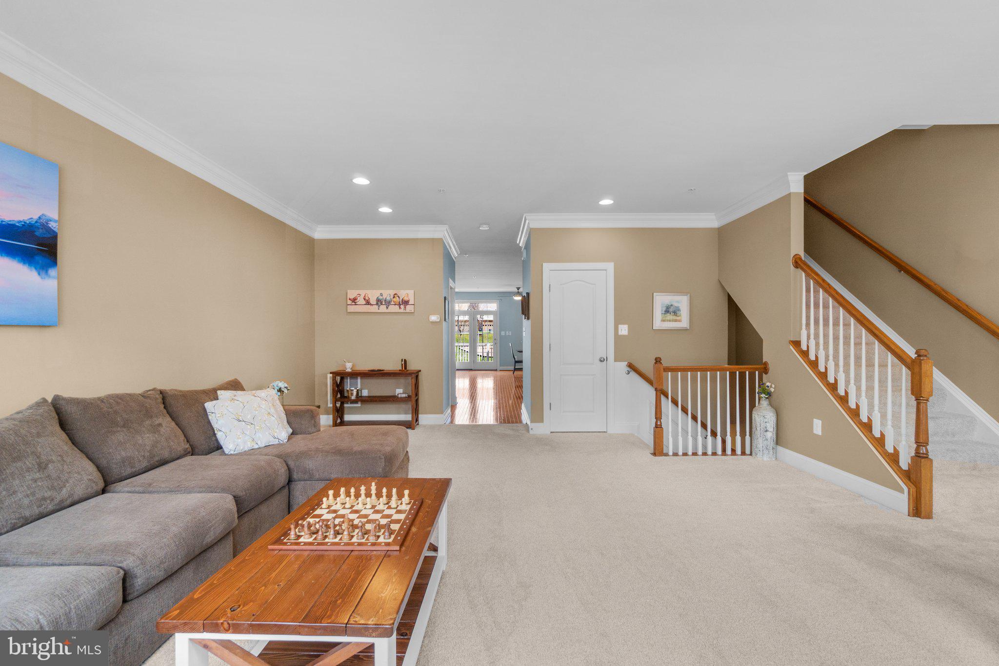 9644 Bothwell Lane Frederick, MD 21704 - Photo 8 of 68 a living room with furniture and a dining table with wooden floor