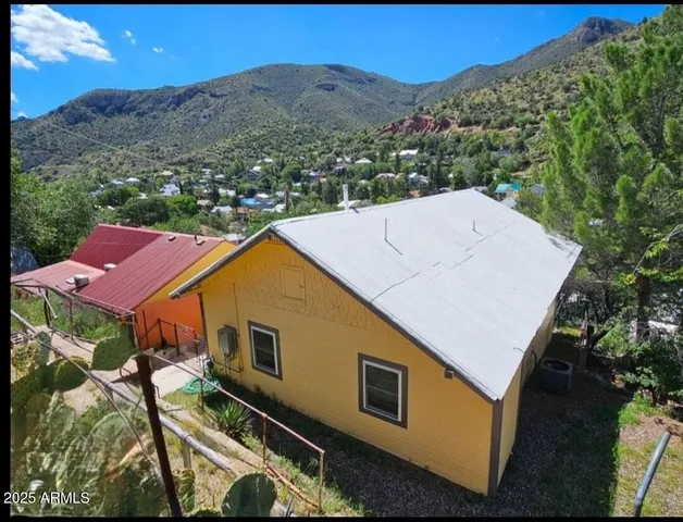 a aerial view of a house with a yard