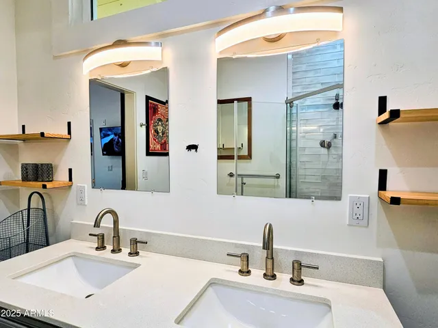 a bathroom with a sink and a mirror