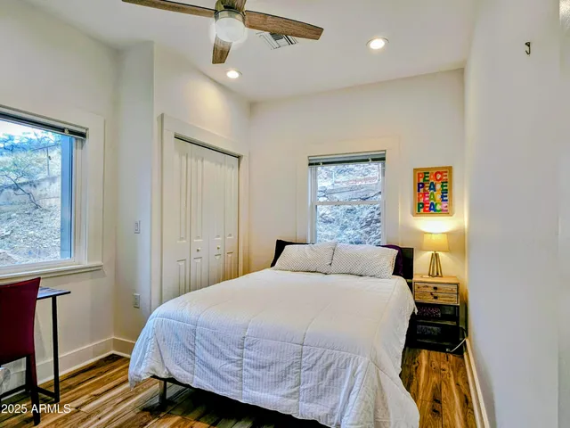 a bedroom with a bed and a window