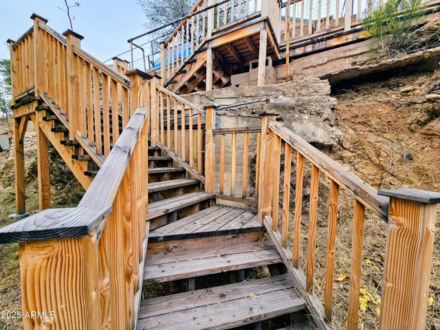 a view of entryway with wooden stairs