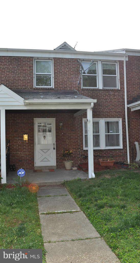 121 Cherrydell Road Catonsville, MD 21228 - Photo 2 of 20 a front view of a house with a yard and garage