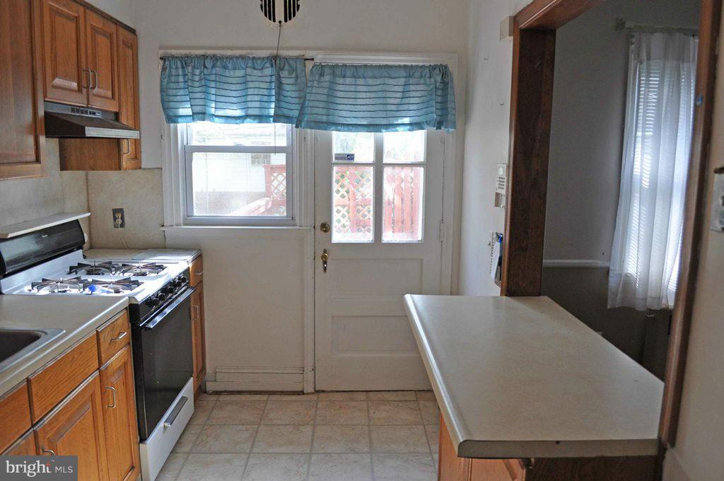 121 Cherrydell Road Catonsville, MD 21228 - Photo 11 of 20 a view of kitchen with windows and refrigerator