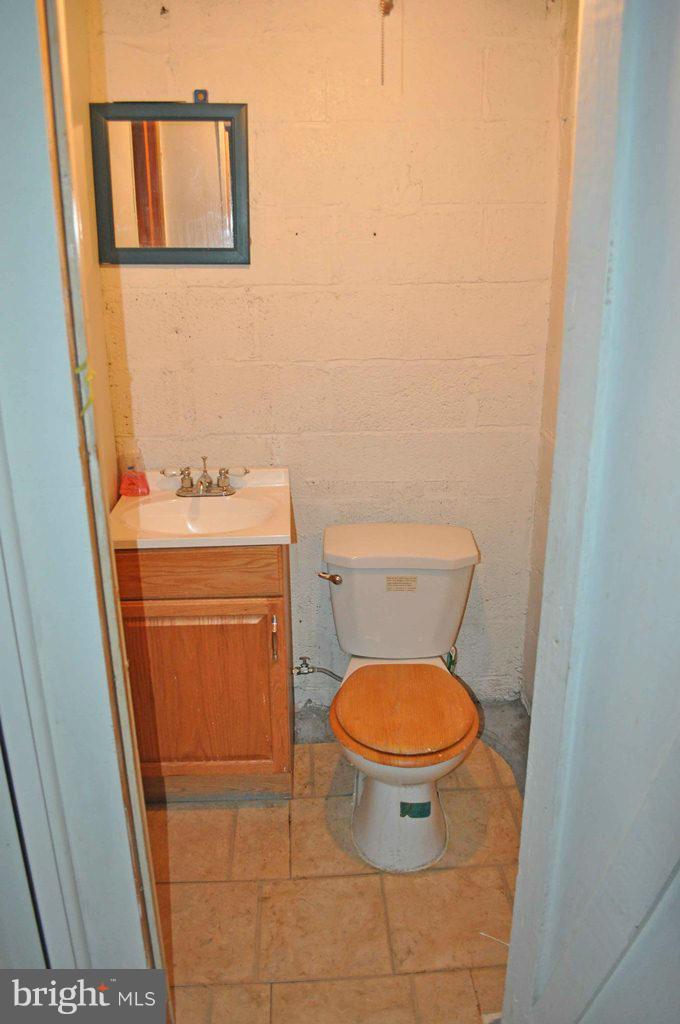 121 Cherrydell Road Catonsville, MD 21228 - Photo 12 of 20 a bathroom with a toilet and a sink