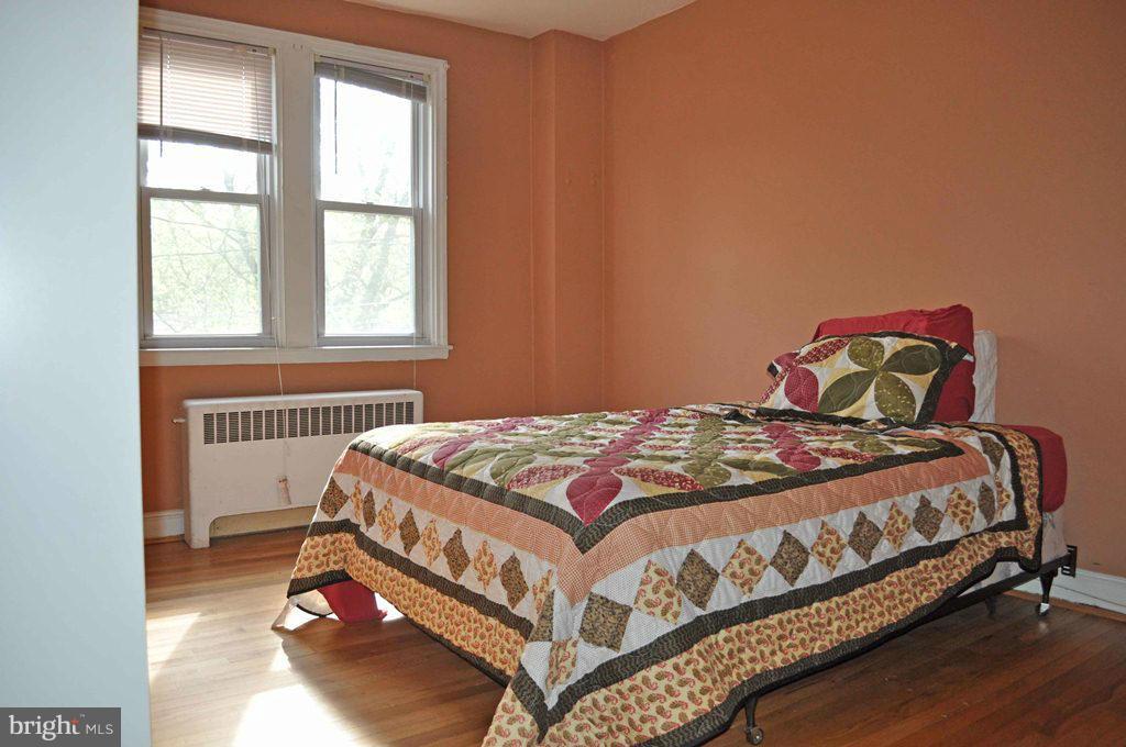 121 Cherrydell Road Catonsville, MD 21228 - Photo 15 of 20 a bedroom with a bed and a window