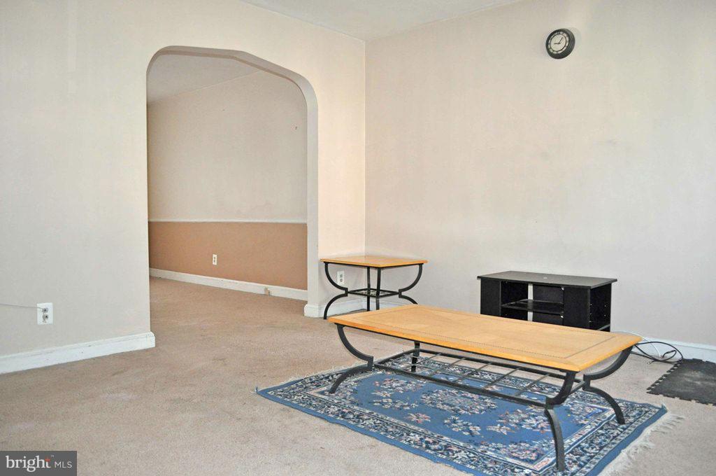 121 Cherrydell Road Catonsville, MD 21228 - Photo 3 of 20 a bench sitting in a room next to a window