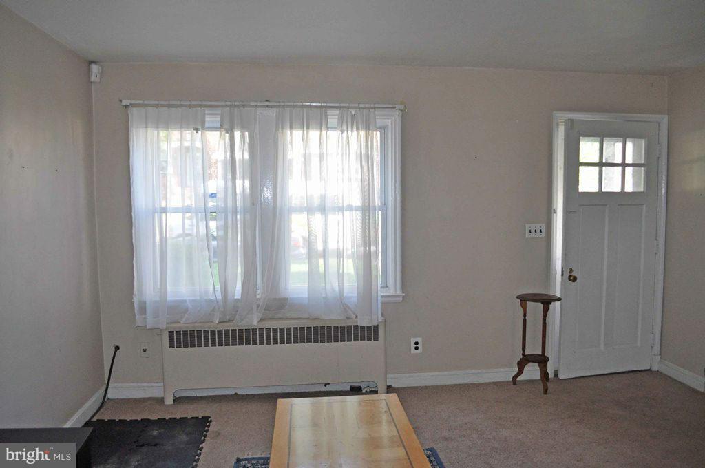 121 Cherrydell Road Catonsville, MD 21228 - Photo 5 of 20 a view of wooden floor and windows in a room