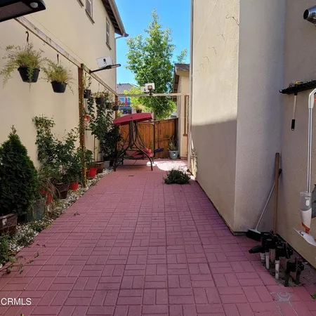 a view of a pathway with a patio