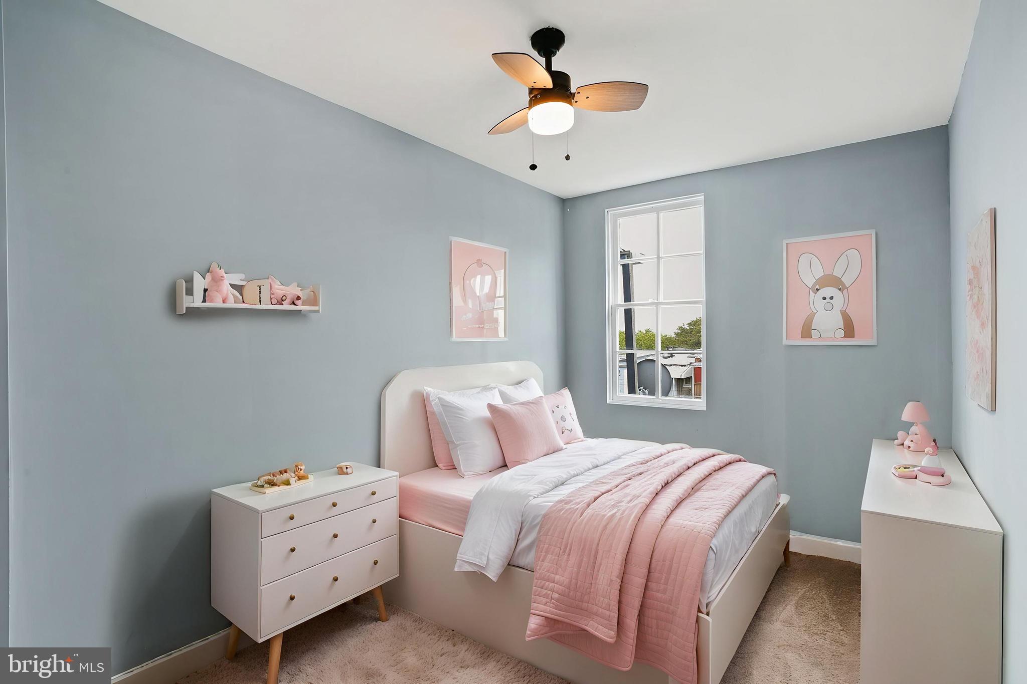 2811 Erdman Avenue Baltimore, MD 21213 - Photo 11 of 17 a bedroom with a bed and a chandelier