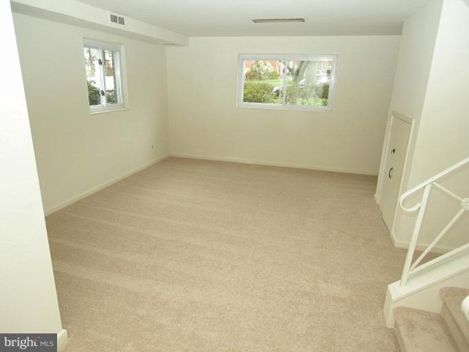 708 Stirling Road Silver Spring, MD 20901 - Photo 7 of 19 an empty room with windows