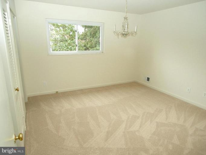708 Stirling Road Silver Spring, MD 20901 - Photo 9 of 19 an empty room with a window